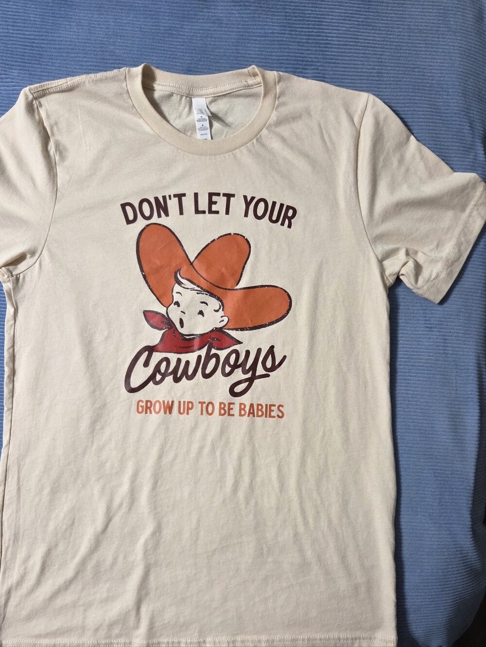 Graphic Tee Don't Let Your Cowboys Grow Up To Be Babies Print